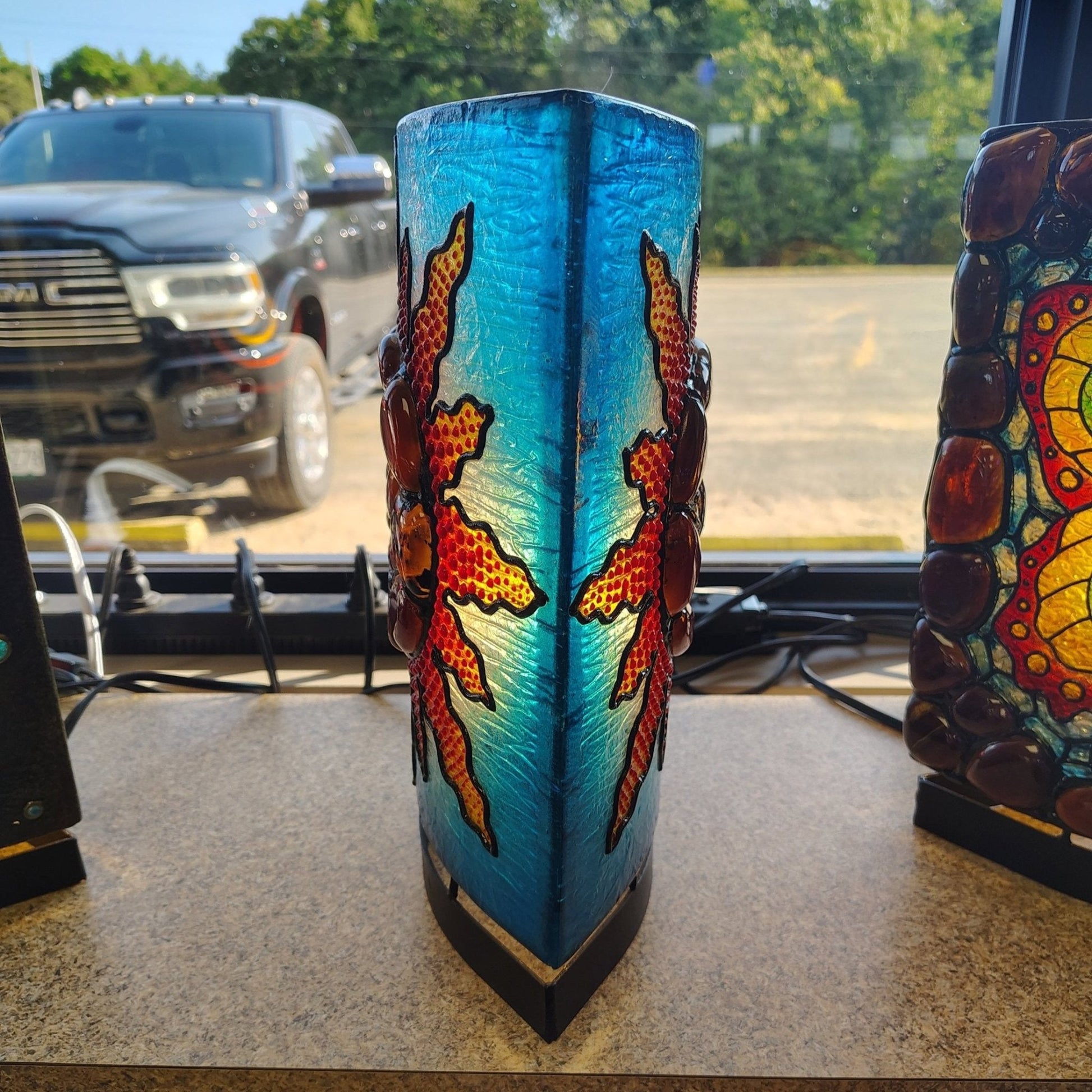 Side view of this Sumatra Amber sunflower and resin lamp