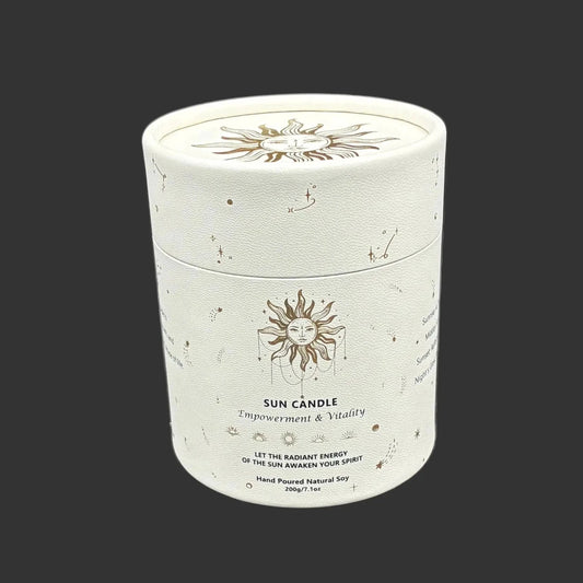 Front side of this sun candle outer container in front of a black background.
