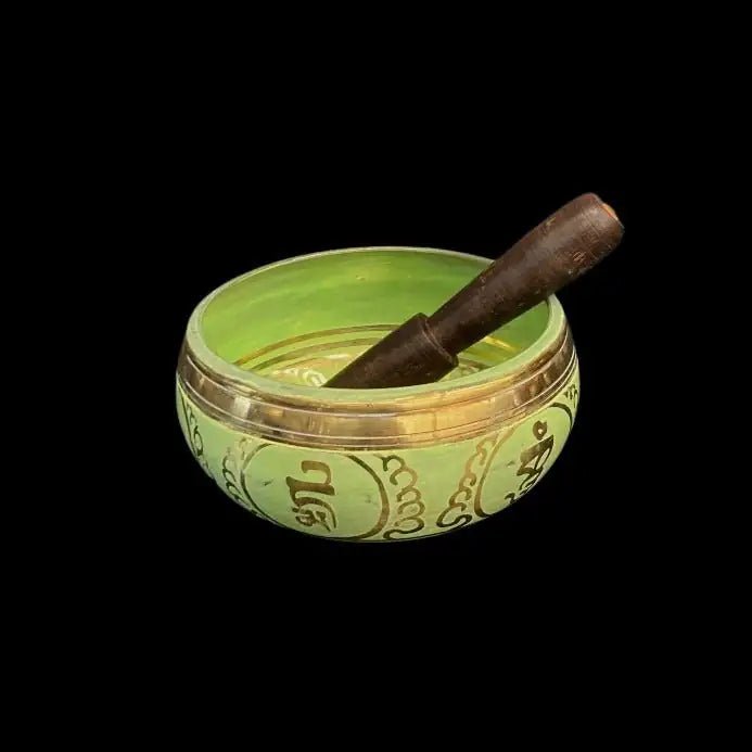 Brass and Light Green Singing Bowl with Chakra symbols and a wooden striking instrument 