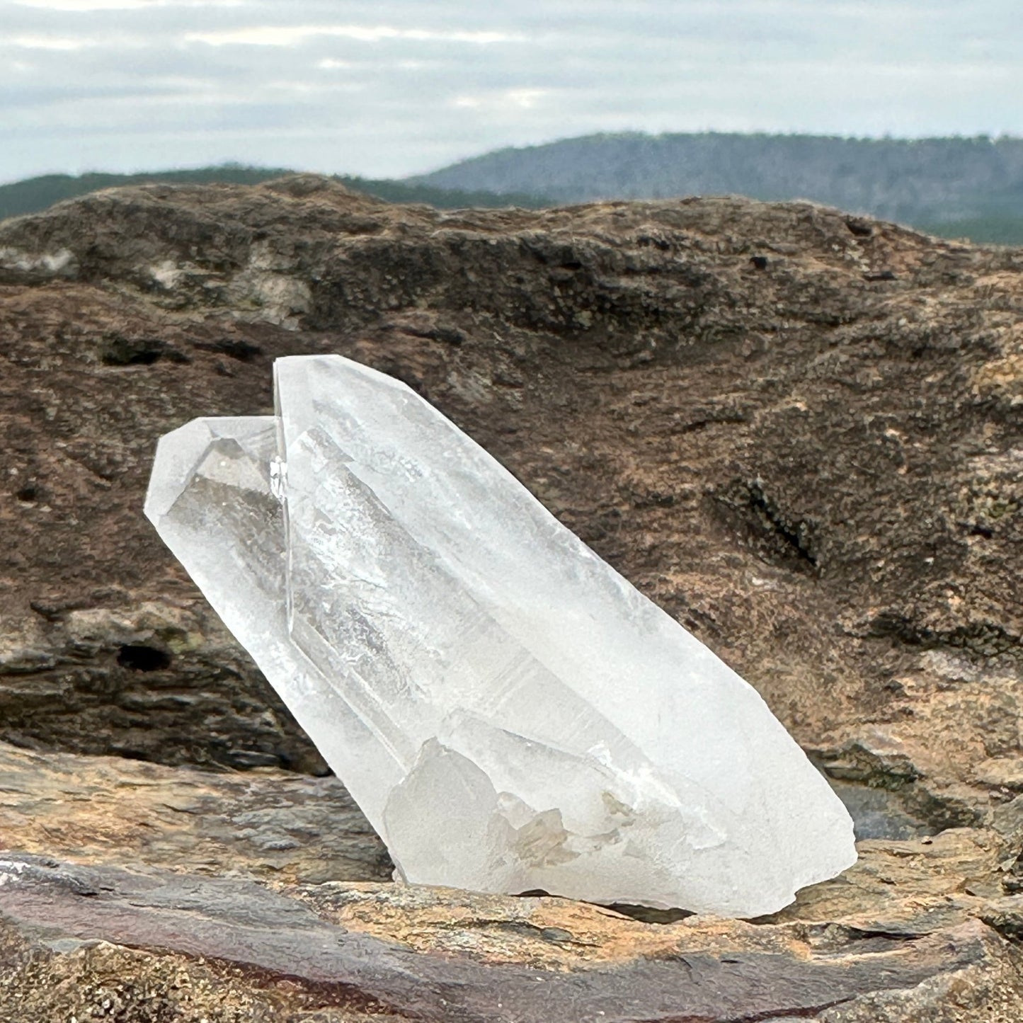 2 point quartz crystal cluster sitting on quartz bolder