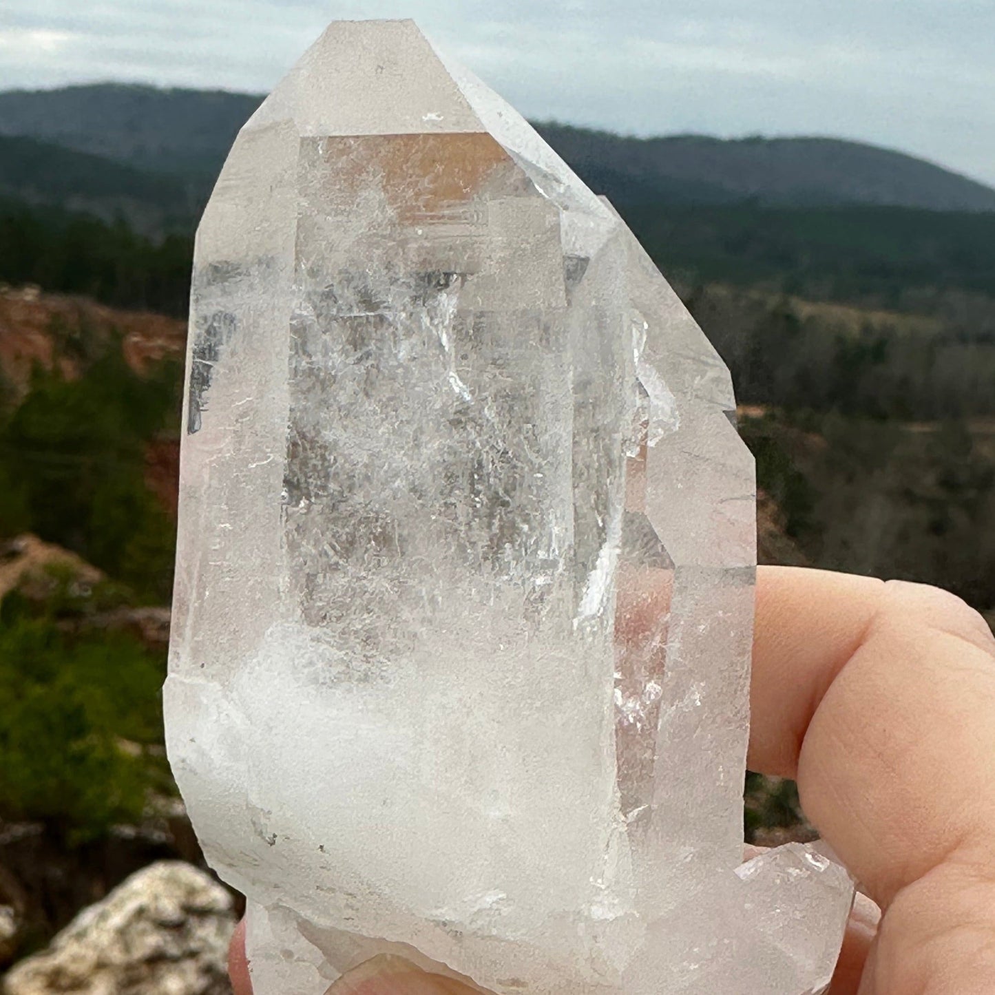 Crystal with Quartz Mine In Background