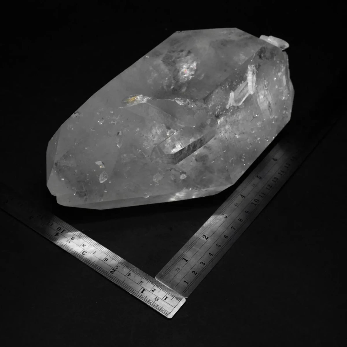 Crystal Point And Two Metal Rulers On A Black Background