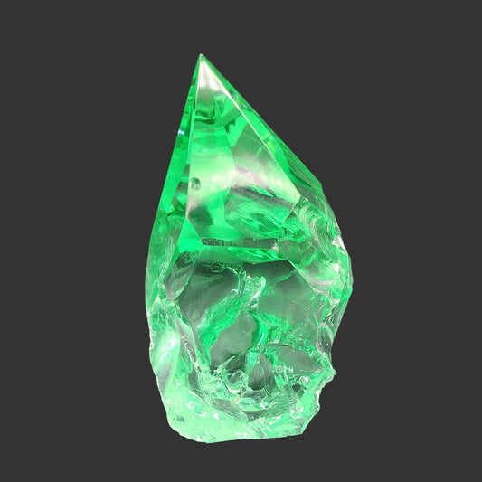 This is the front side of this smooth green volcanic glass point.