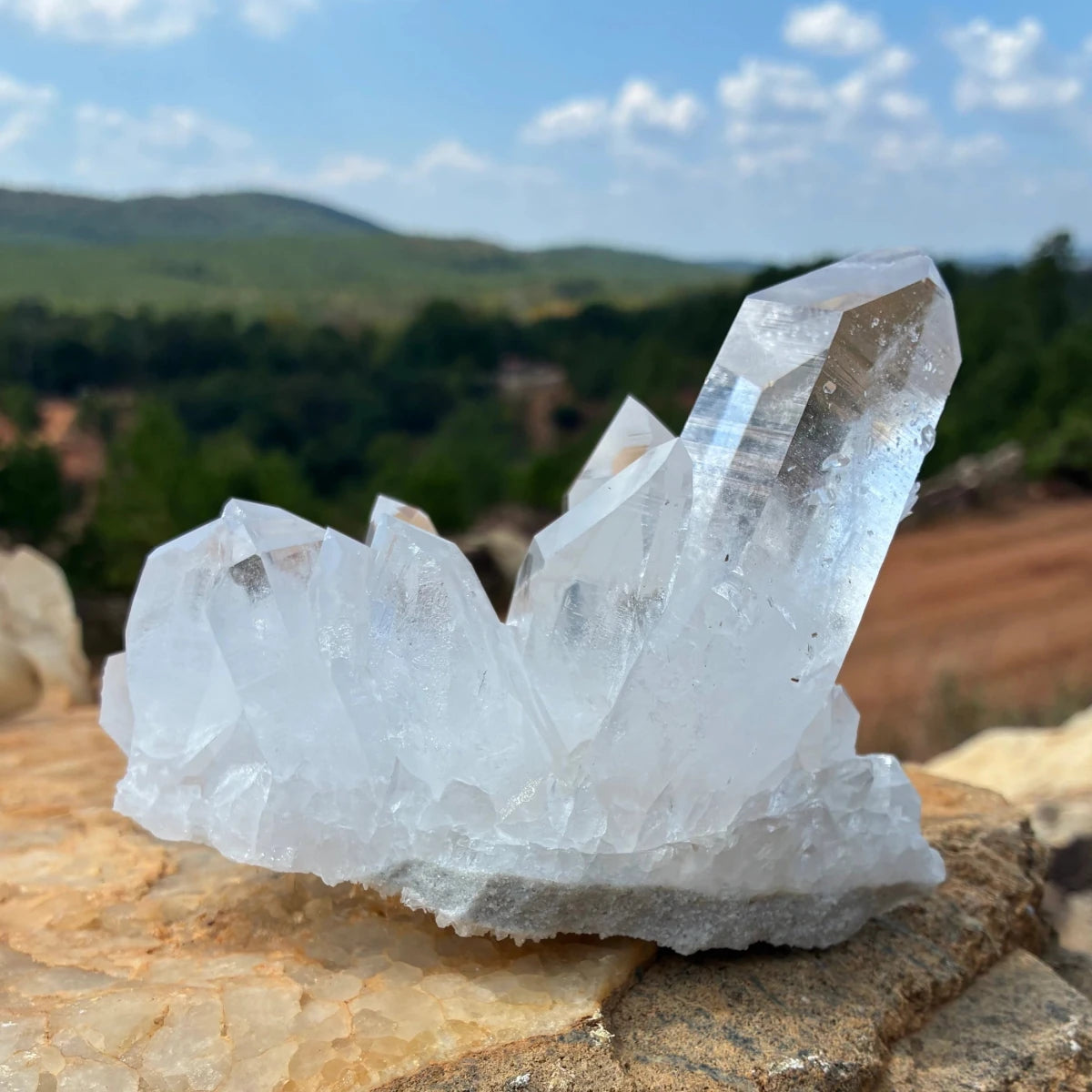 Back side of this quartz cluster, outdoors on a boulder.