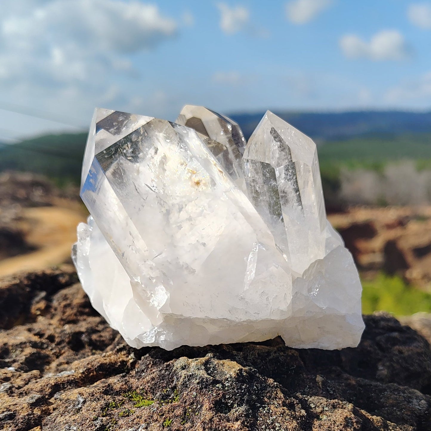 This is the back side of this water clear quartz cluster in natural outdoor light.