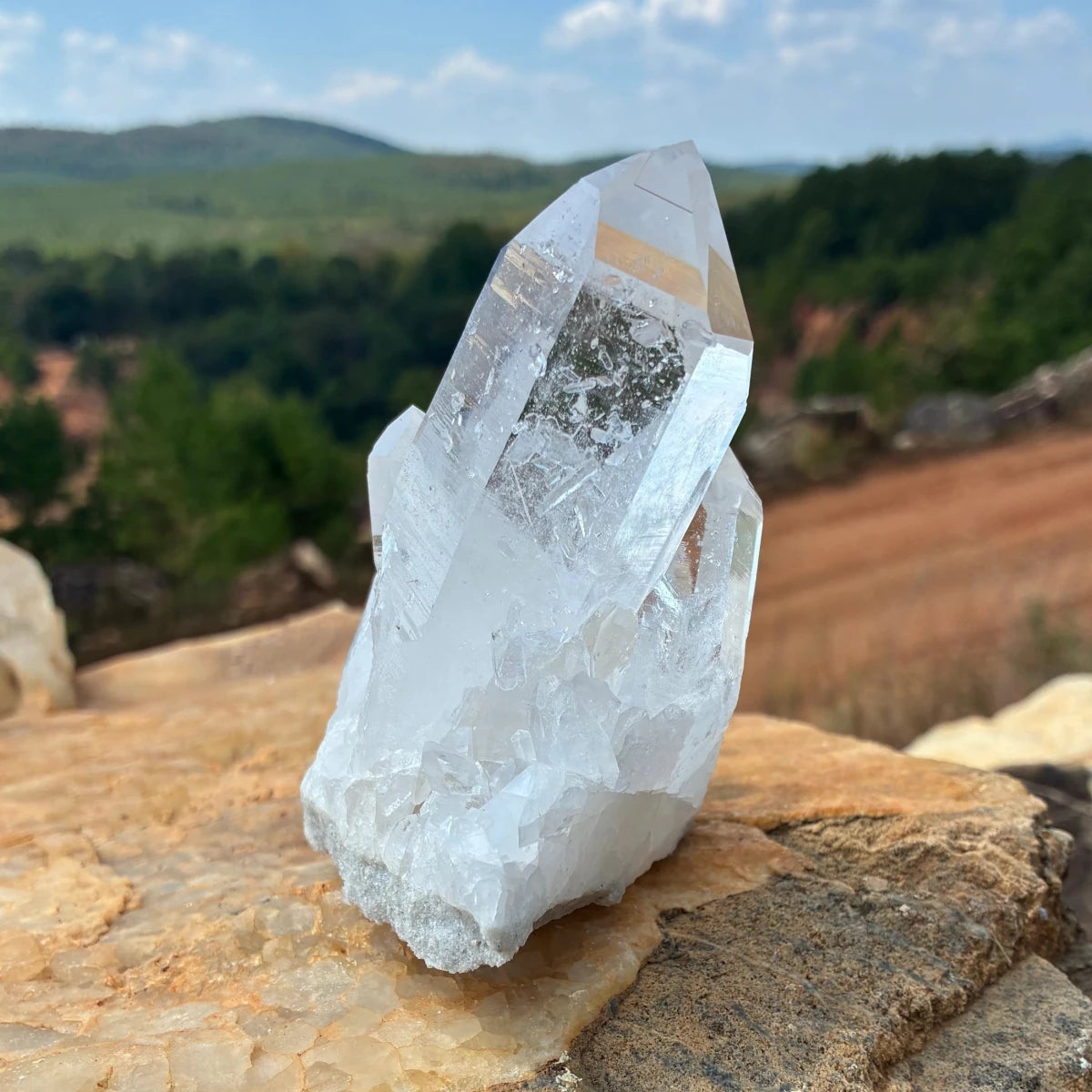 Right side of this quartz cluster, outdoors on a boulder.