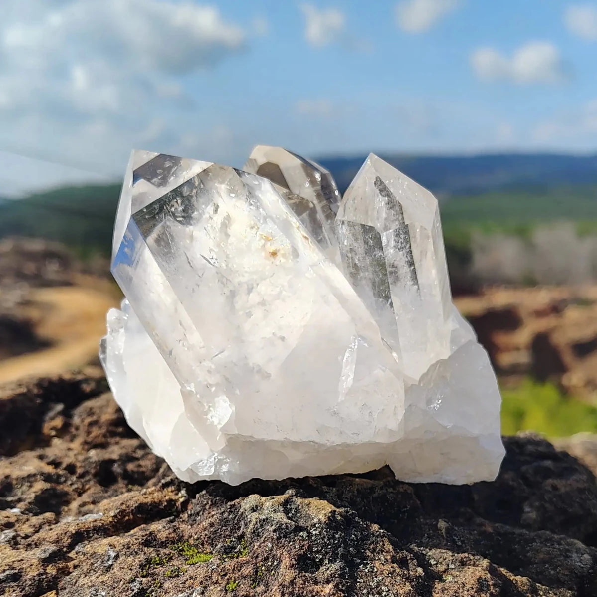 This is the back side of this water clear quartz cluster in natural outdoor light.