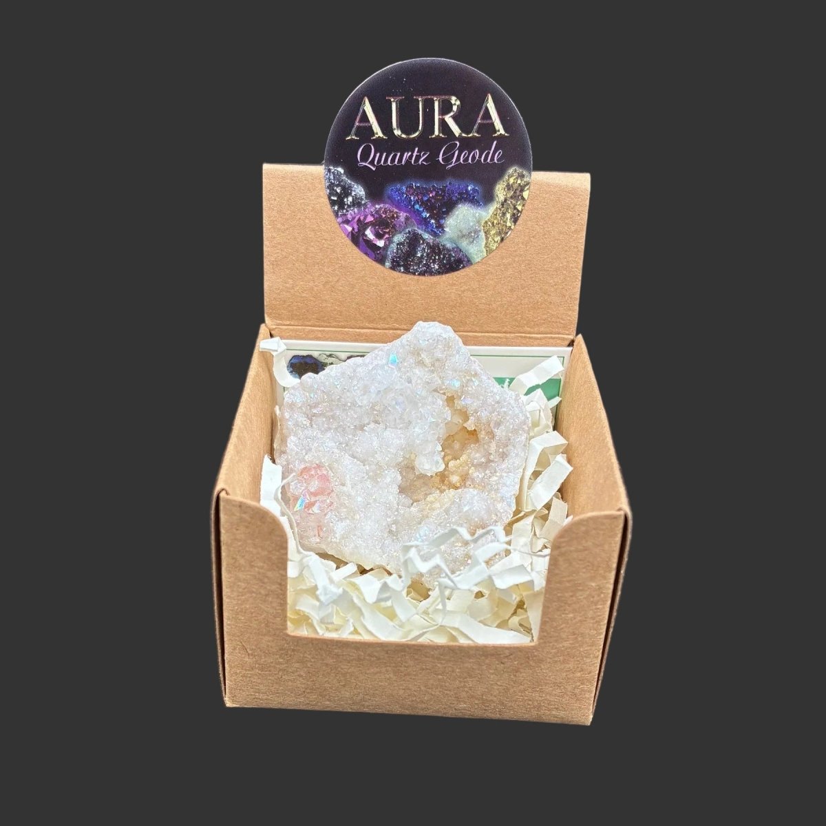 White aura coated quartz geode in the box you will receive it in.