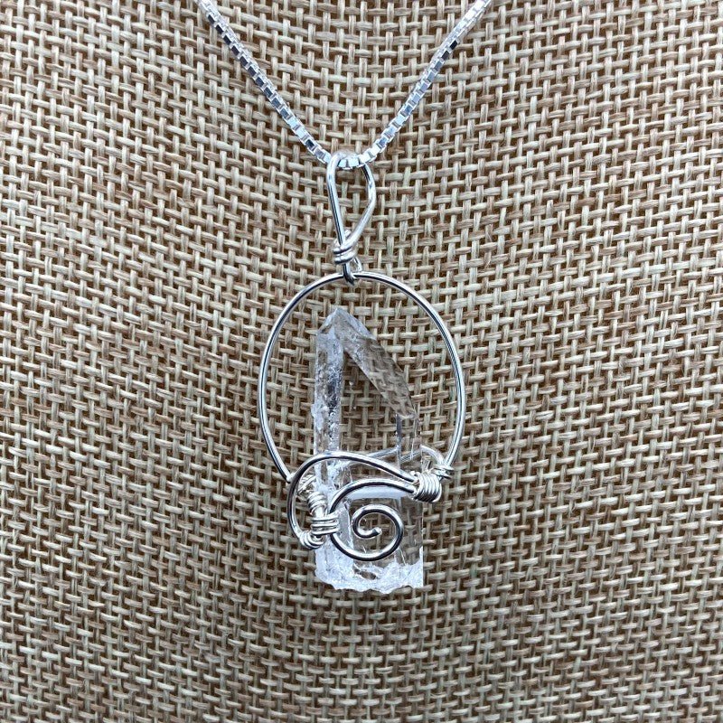 Close Up Of Sterling Silver Wire Wrapped And Also ShortCrystal Point Pendant, Quartz Is Water CLear