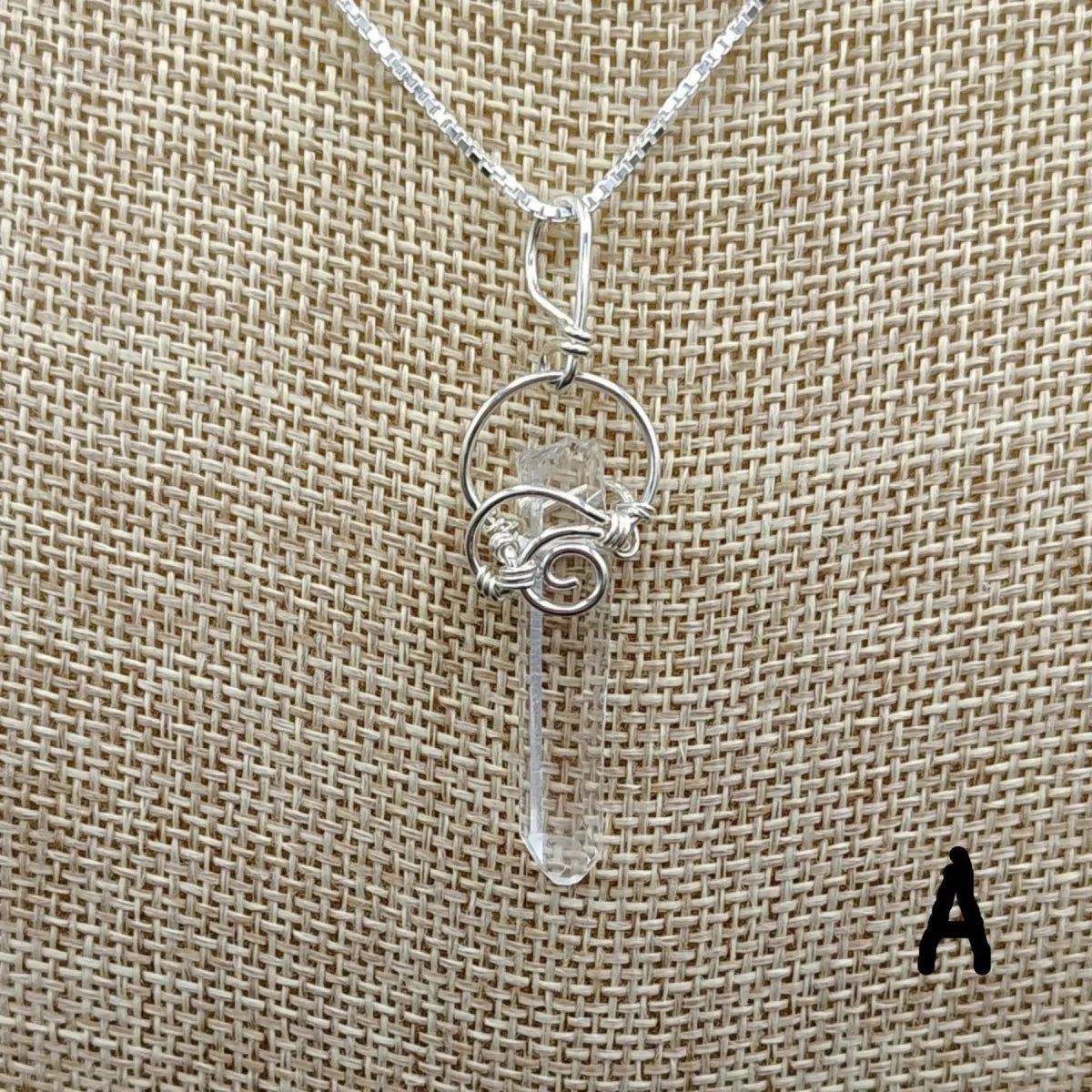 This is a close up of the Sterling Silver wire wrapped Quartz crystal point necklace