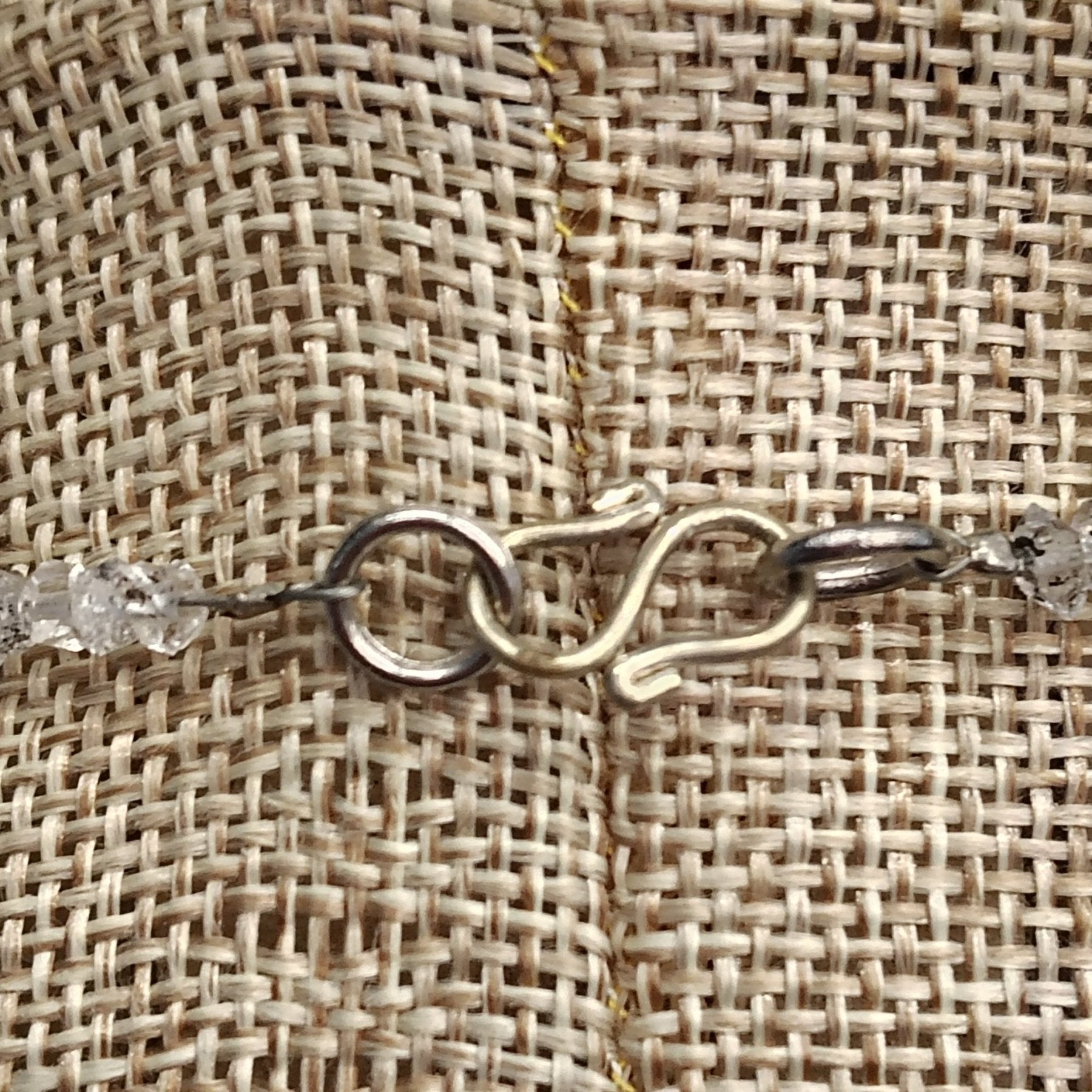 This is a close up of the sterling silver s-hook clasp.