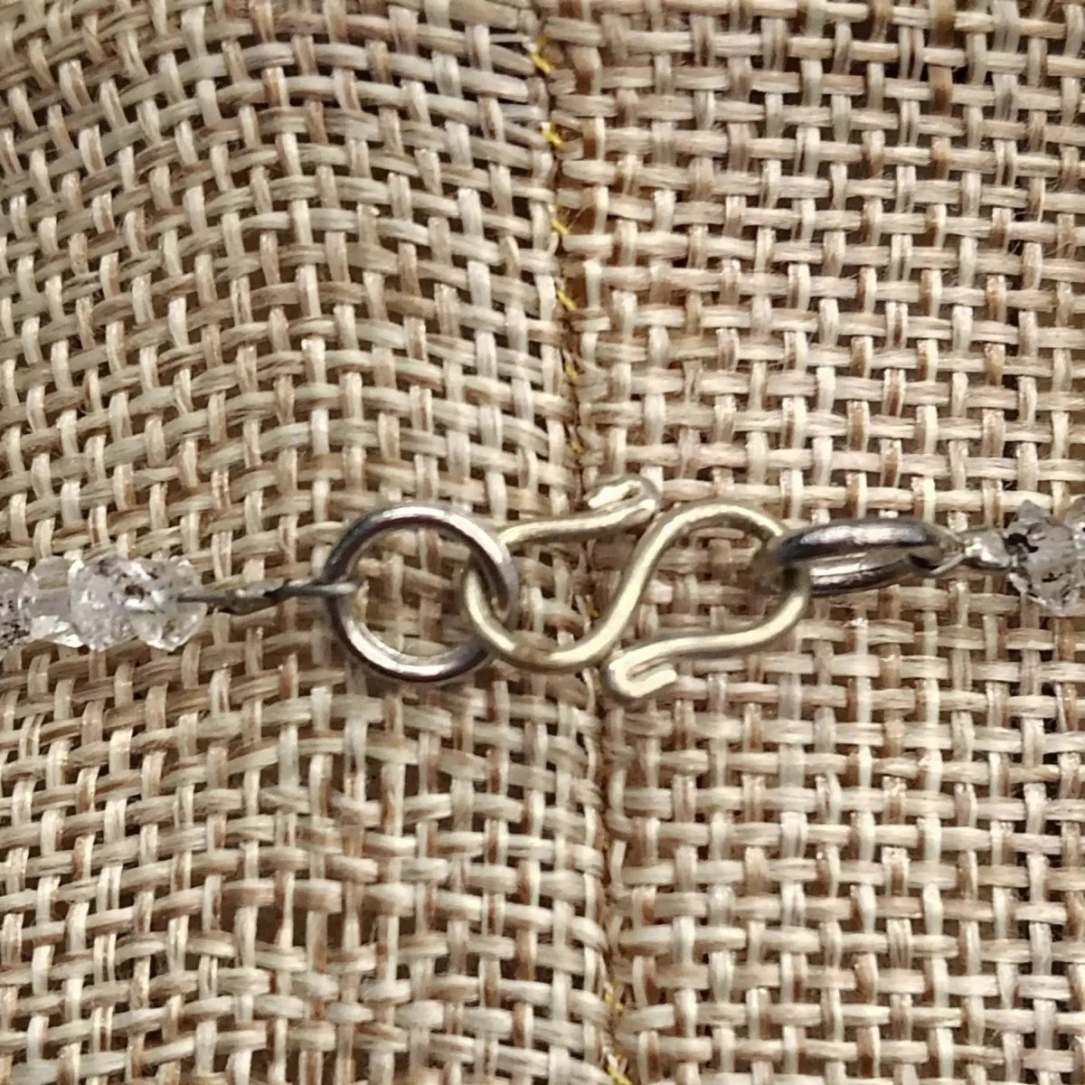 This is a close up of the sterling silver s-hook clasp.