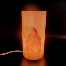 Load image into Gallery viewer, Onyx Table Lamp Cylinder Lit Up in Dark Room
