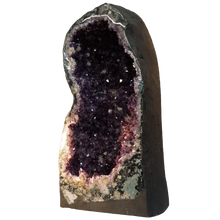 Load image into Gallery viewer, Amethyst Cathedral Geode right side showing purple crystals, gray  outside and polished frong
