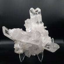 Load image into Gallery viewer, View Of Ron Coleman Quartz Crystal Cluster With Collectible Characteristics on Stand
