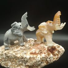 Load image into Gallery viewer, Two Onyx Carved Savage Elephants
