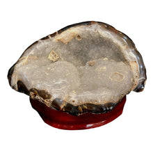 Load image into Gallery viewer, Big Agate Specimen Displaying White Drusy Crystals Throughout Piece On Wooden Stand
