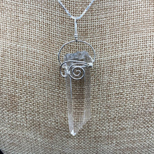 Load image into Gallery viewer, Close Up Of Water Clear Crystal Pendant, Sterling Silver Wire In A curly Design To Hold The Clear Crystal Point
