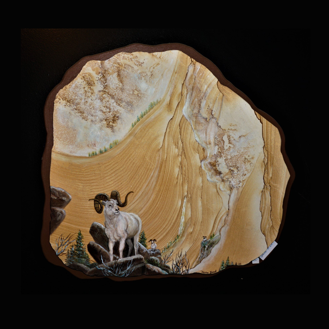 Big Horn Sheep Painted On Sandstone On Snowcovered Mountain