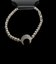 Load image into Gallery viewer, White Tone Stretch Bracelet With Half Moon Design
