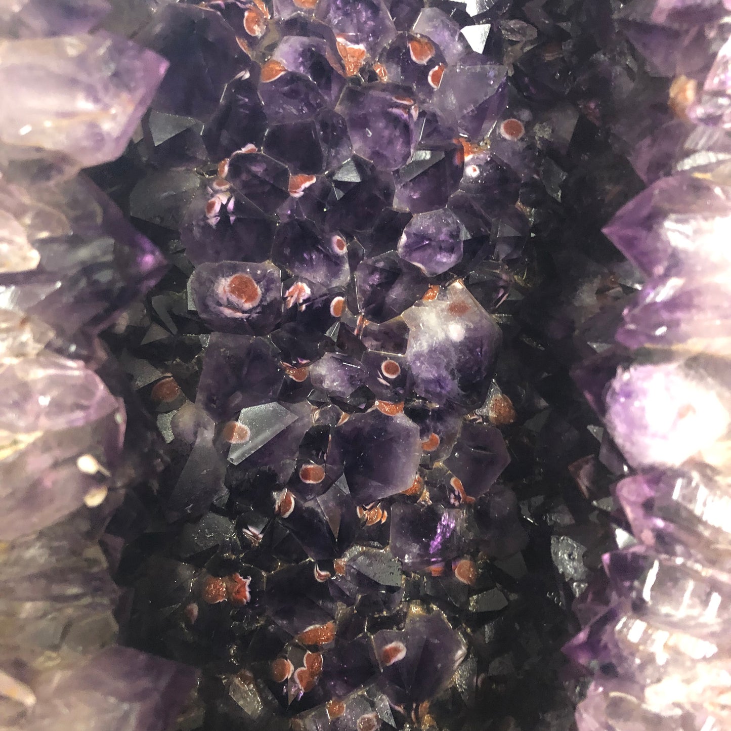 Close Up Of Amethyst Crystals Within A Geode